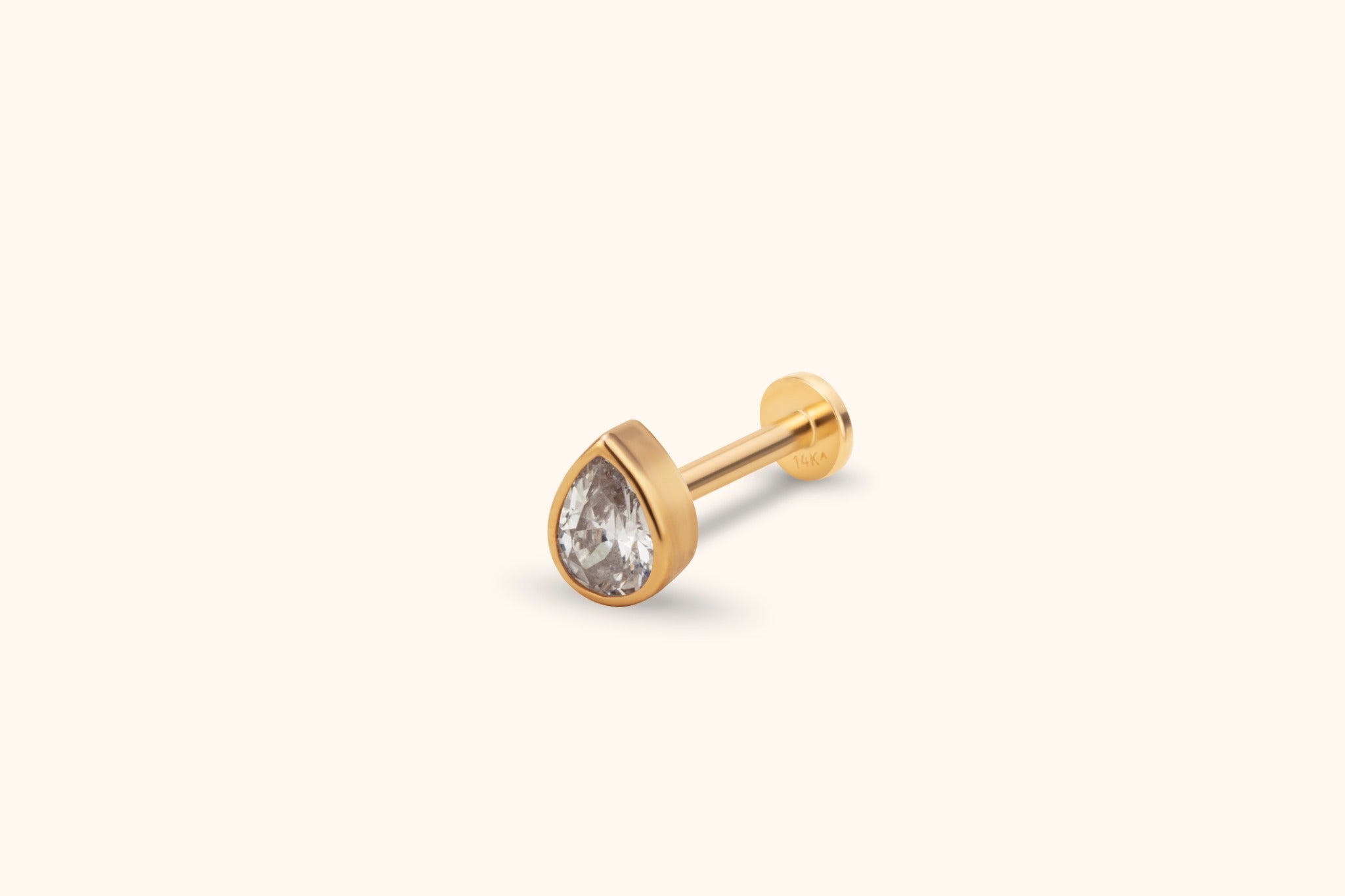 14K Guld Traguspiercing Med Droppformad Sten Och Elegant Minimalistisk Design - Noxlookjewelry